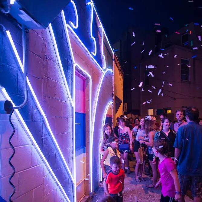 Blue and pink LED neon flex lighting on an entertainment venue facade